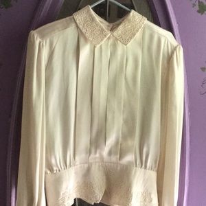 Cream satin Victorian long sleeved blouse.